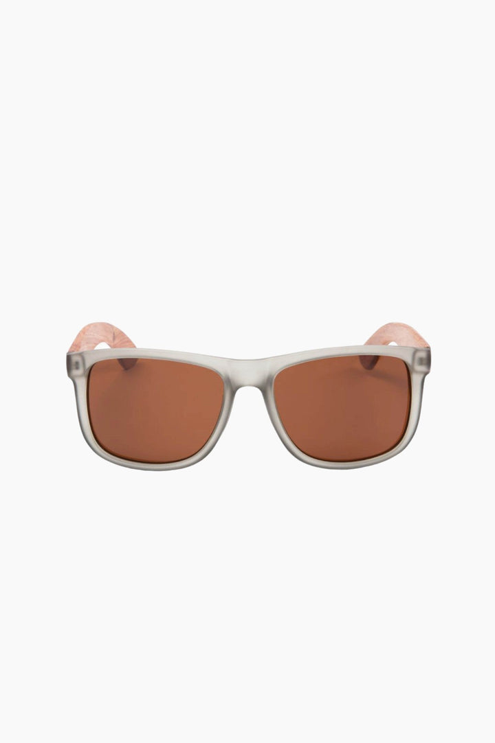 Clear, grey-tinted framed sunglasses with wooden temple piece.