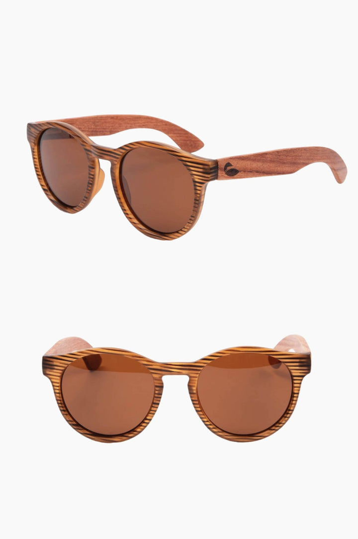 Round wood-looking framed sunglasses with wooden temple pieces.